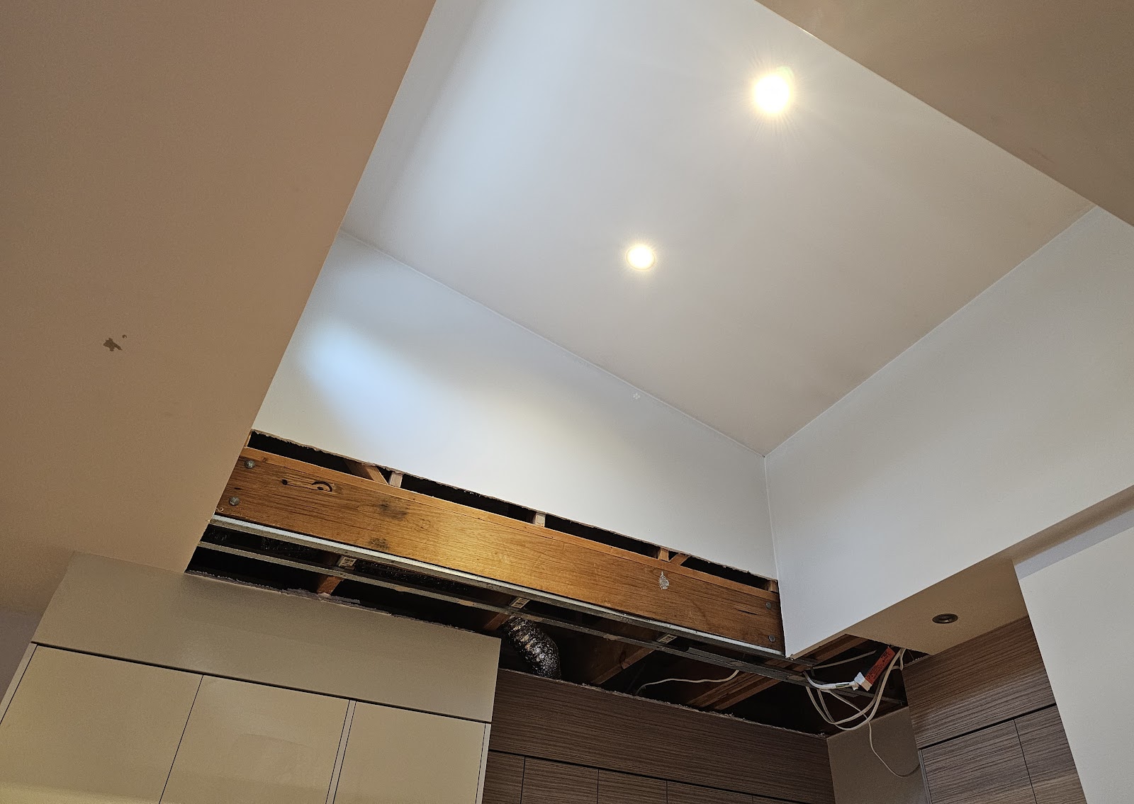 Raked ceiling section opened above the kitchen